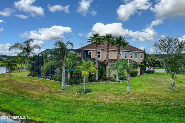 2148 S Sorrento Hills Rd, Saint Augustine, FL 32092 - view of front facade with stucco siding, a front lawn, and glass enclosure
