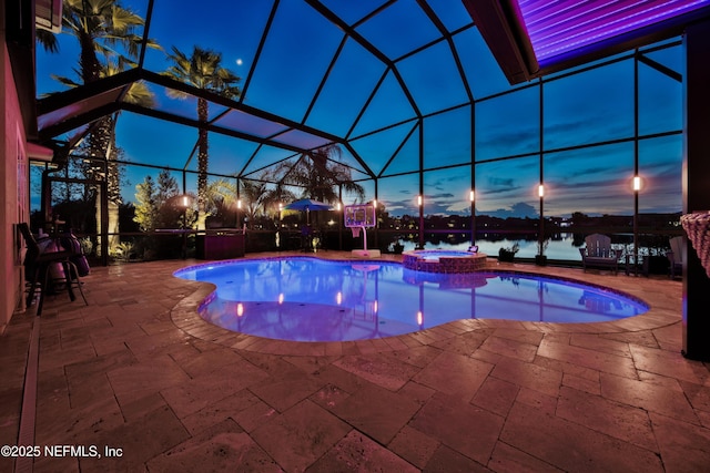 2148 S Sorrento Hills Rd, Saint Augustine, FL 32092 - view of pool featuring a patio, a pool with connected hot tub, glass enclosure, and a water view