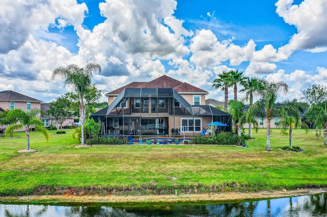2148 S Sorrento Hills Rd, Saint Augustine, FL 32092 - rear view of property with a lanai, a swimming pool, a lawn, stucco siding, and a water view