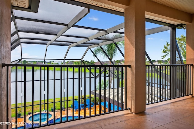 2148 S Sorrento Hills Rd, Saint Augustine, FL 32092 - view of patio with a water view, glass enclosure, an in-ground hot tub, and an outdoor pool