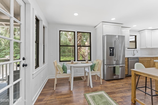 1381 Forrest Dr, Fernandina Beach, FL 32034 - kitchen with stainless steel appliances, plenty of natural light, light countertops, dark wood finished floors, and recessed lighting