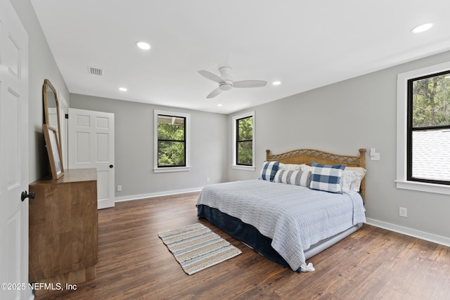 1381 Forrest Dr, Fernandina Beach, FL 32034 - bedroom with wood finished floors, multiple windows, baseboards, and recessed lighting