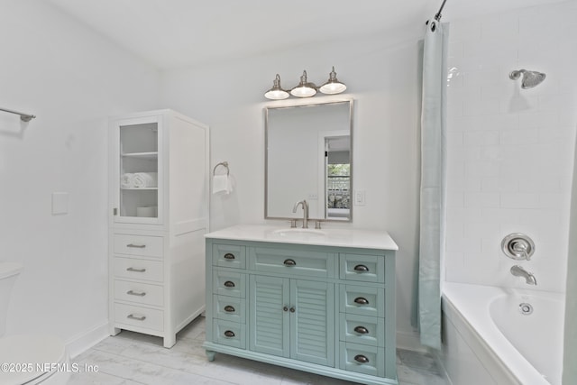 1381 Forrest Dr, Fernandina Beach, FL 32034 - bathroom with vanity, toilet, baseboards, and shower / bath combo