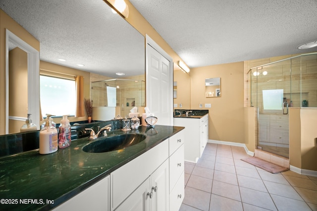 10571 Fox Squirrel Ct, Jacksonville, FL 32257 - full bathroom with a textured ceiling, a shower stall, vanity, and tile patterned flooring
