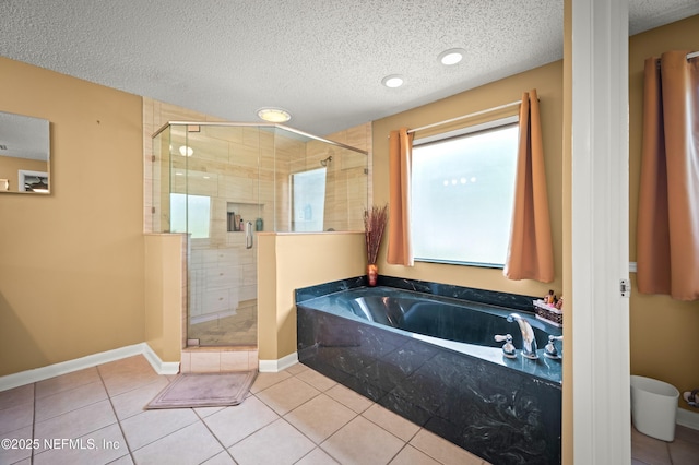 10571 Fox Squirrel Ct, Jacksonville, FL 32257 - full bath featuring a bath, a stall shower, a textured ceiling, and tile patterned floors