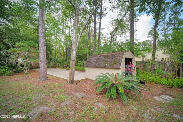 10571 Fox Squirrel Ct, Jacksonville, FL 32257 - view of yard featuring a storage shed and a patio area