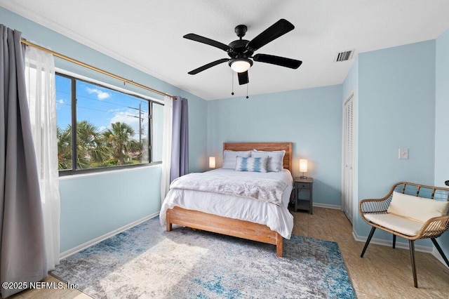 3145 Coastal Hwy Unit 1162, Saint Augustine, FL 32084 - bedroom featuring baseboards, wood finished floors, a closet, and ceiling fan