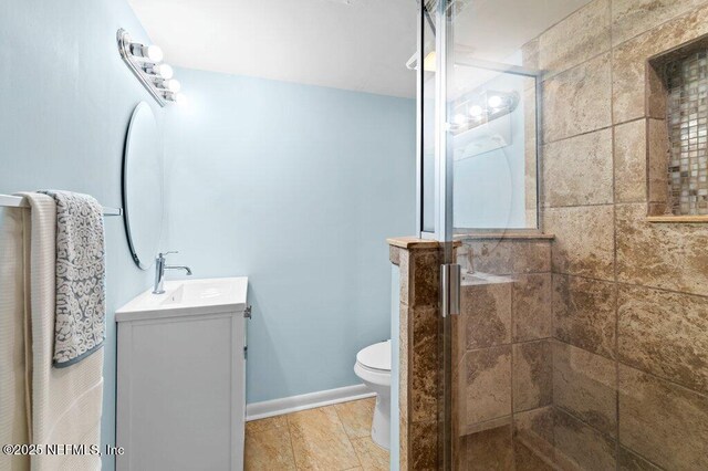 3145 Coastal Hwy Unit 1162, Saint Augustine, FL 32084 - full bathroom with vanity, a stall shower, and toilet
