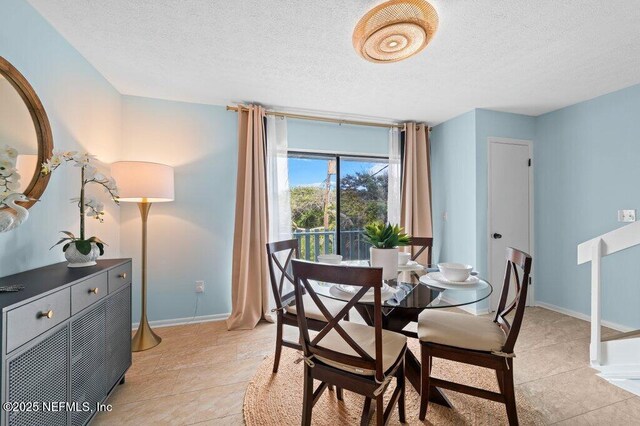 3145 Coastal Hwy Unit 1162, Saint Augustine, FL 32084 - dining room featuring a textured ceiling and baseboards
