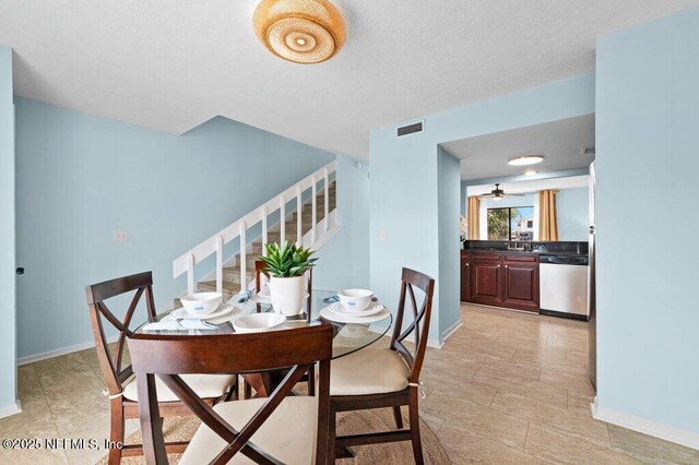 3145 Coastal Hwy Unit 1162, Saint Augustine, FL 32084 - dining space with stairs, baseboards, and ceiling fan