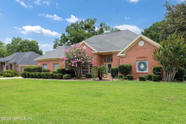 1766 Buttonbush Way, Fleming Island, FL 32003 - view of front of house featuring a front lawn and brick siding