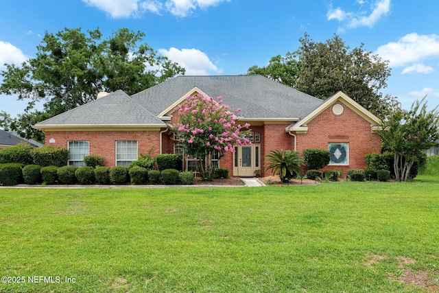 1766 Buttonbush Way, Fleming Island, FL 32003 - view of front of property with a front lawn, brick siding, and a shingled roof