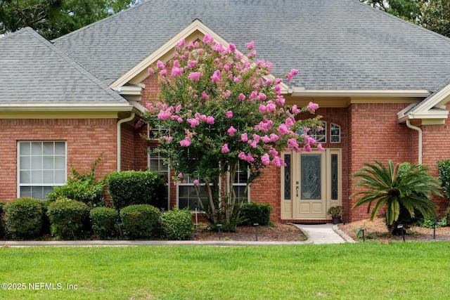 1766 Buttonbush Way, Fleming Island, FL 32003 - view of front of home with brick siding, roof with shingles, and a front lawn