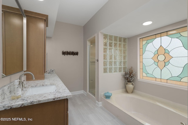 1766 Buttonbush Way, Fleming Island, FL 32003 - full bath featuring vanity, a bath, and a stall shower