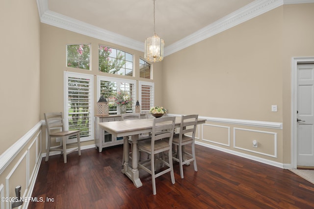 1766 Buttonbush Way, Fleming Island, FL 32003 - dining area featuring ornamental molding, a chandelier, a decorative wall, dark wood finished floors, and wainscoting
