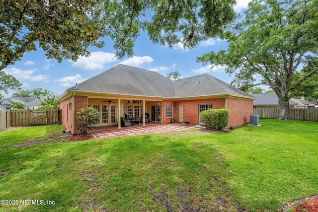 1766 Buttonbush Way, Fleming Island, FL 32003 - rear view of property with ceiling fan, brick siding, a fenced backyard, a patio area, and french doors