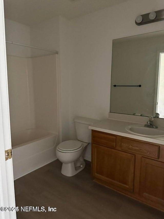 9625 Amarante Way Unit 12, Jacksonville, FL 32257 - full bath with vanity, wood finished floors, toilet, and shower / bathtub combination