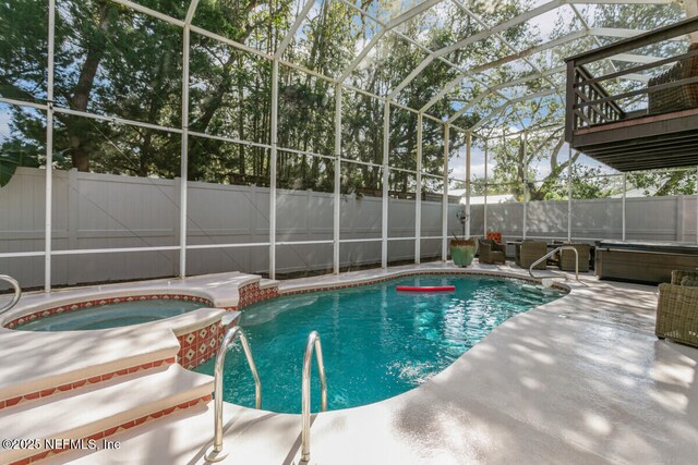 4 Santa Maria Ln, Saint Augustine, FL 32080 - view of pool featuring a patio area, a fenced backyard, a pool with connected hot tub, and a lanai