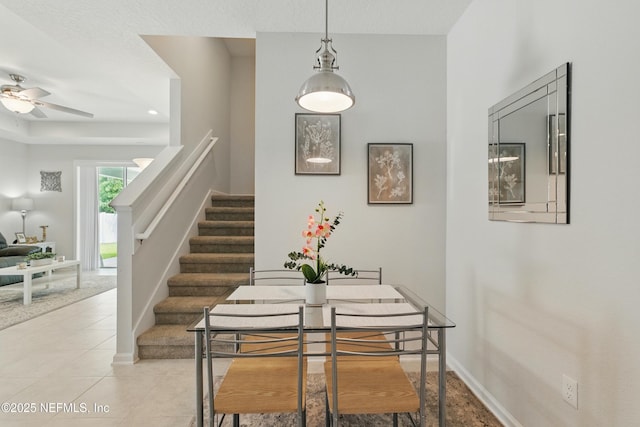 95362 Cornflower Dr, Fernandina Beach, FL 32034 - dining area featuring stairway, ceiling fan, and light tile patterned floors