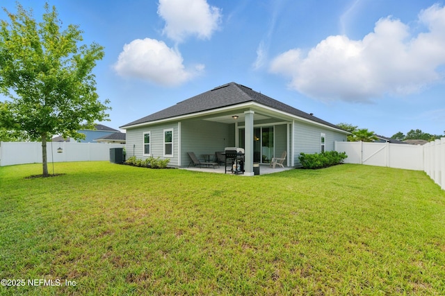 95362 Cornflower Dr, Fernandina Beach, FL 32034 - back of house with a patio, a fenced backyard, and a shingled roof