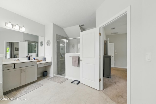 95362 Cornflower Dr, Fernandina Beach, FL 32034 - full bathroom featuring a shower stall, vanity, tile patterned flooring, and vaulted ceiling