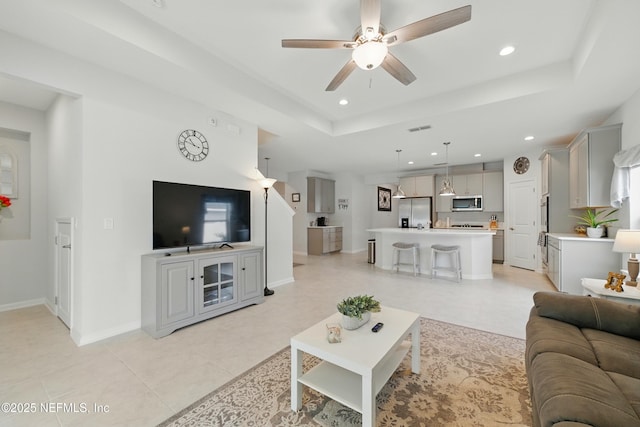 95362 Cornflower Dr, Fernandina Beach, FL 32034 - living area with a ceiling fan, recessed lighting, a raised ceiling, and light tile patterned floors