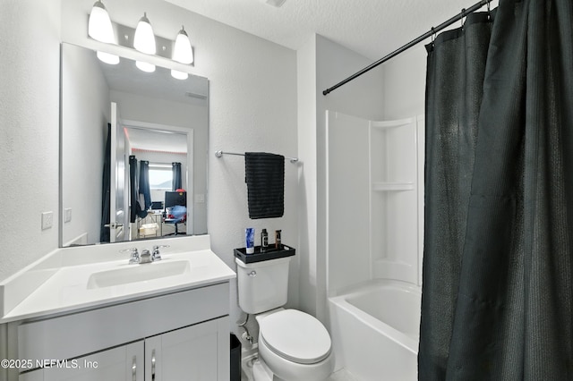 95362 Cornflower Dr, Fernandina Beach, FL 32034 - bathroom with vanity, a textured wall, shower / bath combo, and a textured ceiling