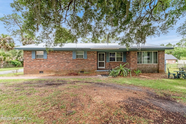 97150 Caravel Trl, Yulee, FL 32097 - ranch-style home with crawl space, brick siding, and metal roof
