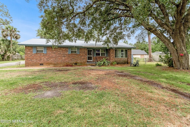 97150 Caravel Trl, Yulee, FL 32097 - single story home featuring crawl space, brick siding, and metal roof