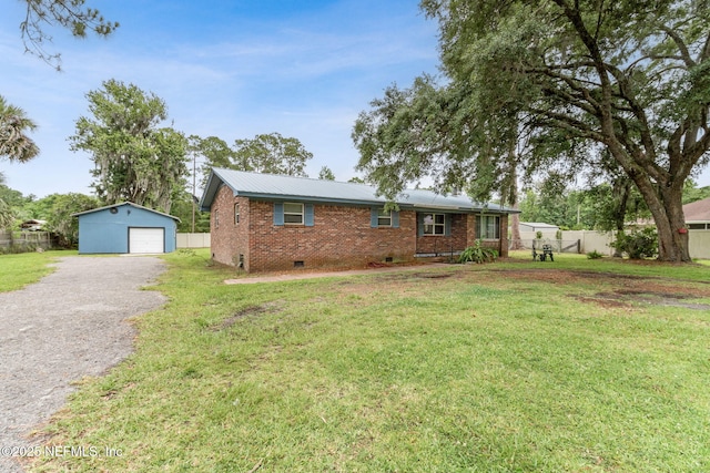 97150 Caravel Trl, Yulee, FL 32097 - single story home featuring crawl space, a detached garage, brick siding, an outbuilding, and gravel driveway