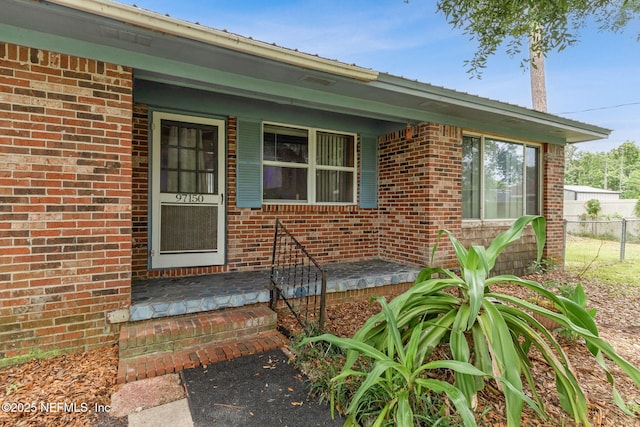 97150 Caravel Trl, Yulee, FL 32097 - property entrance featuring brick siding and a porch