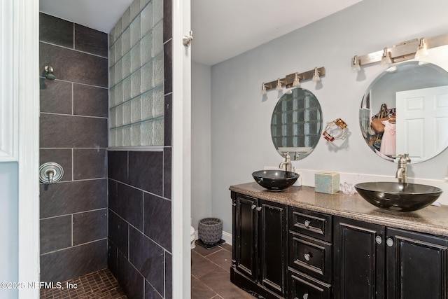 97150 Caravel Trl, Yulee, FL 32097 - full bathroom featuring double vanity, tile patterned floors, tiled shower, and toilet
