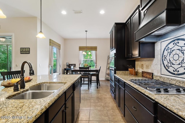 46 Gabacho Ct, Saint Augustine, FL 32095 - kitchen featuring premium range hood, appliances with stainless steel finishes, light tile patterned floors, pendant lighting, and tasteful backsplash