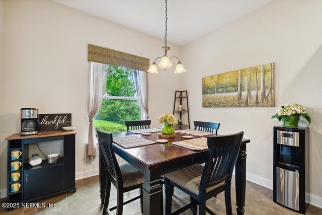46 Gabacho Ct, Saint Augustine, FL 32095 - dining room with a chandelier and tile patterned floors
