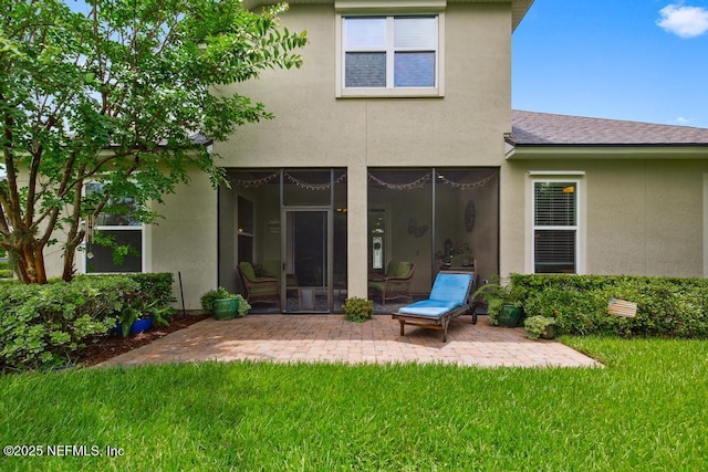 46 Gabacho Ct, Saint Augustine, FL 32095 - rear view of property featuring a patio, a yard, stucco siding, and roof with shingles