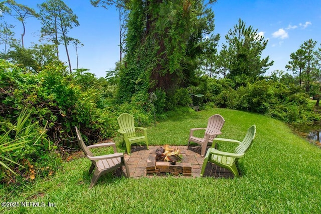 46 Gabacho Ct, Saint Augustine, FL 32095 - view of green lawn with a fire pit