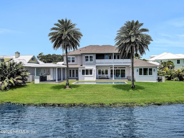 532 Atlantic Beach Ct, Atlantic Beach, FL 32233 - rear view of property featuring a water view, a balcony, a yard, and a patio