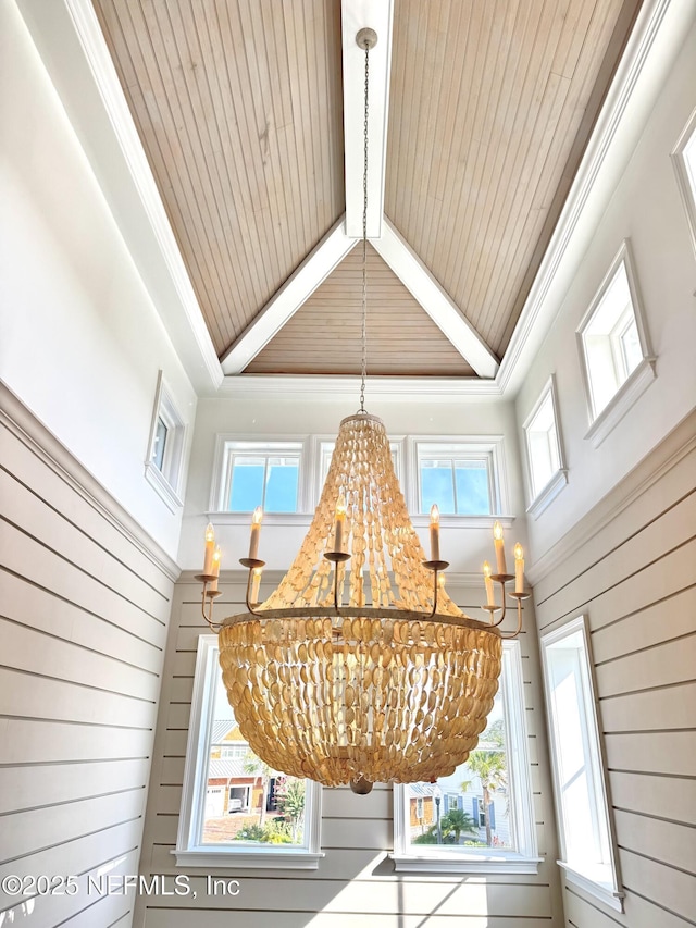 532 Atlantic Beach Ct, Atlantic Beach, FL 32233 - detailed view of a chandelier, crown molding, wood walls, and a wood ceiling with exposed beams