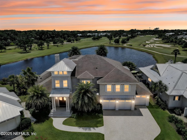 532 Atlantic Beach Ct, Atlantic Beach, FL 32233 - view of front of home with a water view, driveway, a garage, and view of golf course