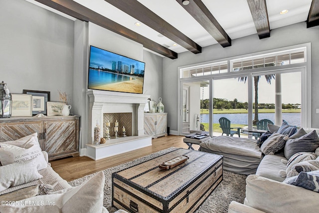 532 Atlantic Beach Ct, Atlantic Beach, FL 32233 - living room with beamed ceiling, wood finished floors, recessed lighting, and a fireplace with raised hearth