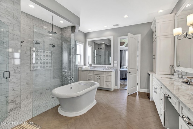 532 Atlantic Beach Ct, Atlantic Beach, FL 32233 - ensuite bathroom featuring a shower stall, vanity, a soaking tub, and recessed lighting