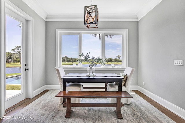 532 Atlantic Beach Ct, Atlantic Beach, FL 32233 - dining room featuring wood finished floors, ornamental molding, and a water view