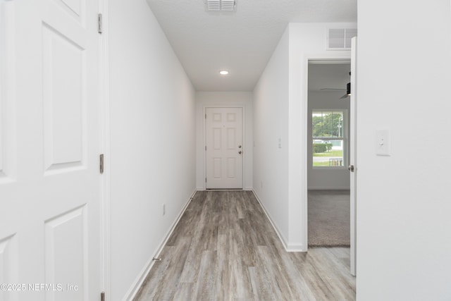 863 W 5th St, Saint Augustine, FL 32084 - corridor with light wood finished floors, baseboards, and recessed lighting