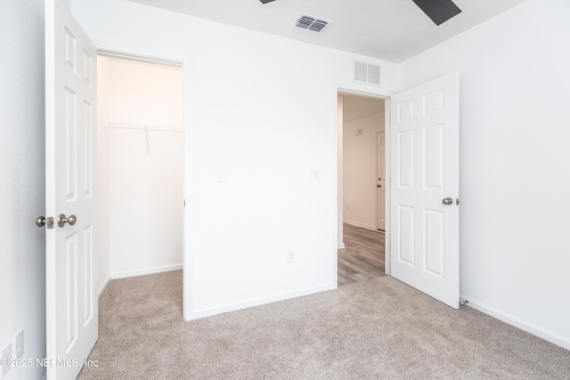 863 W 5th St, Saint Augustine, FL 32084 - unfurnished bedroom with carpet floors, a closet, and a walk in closet