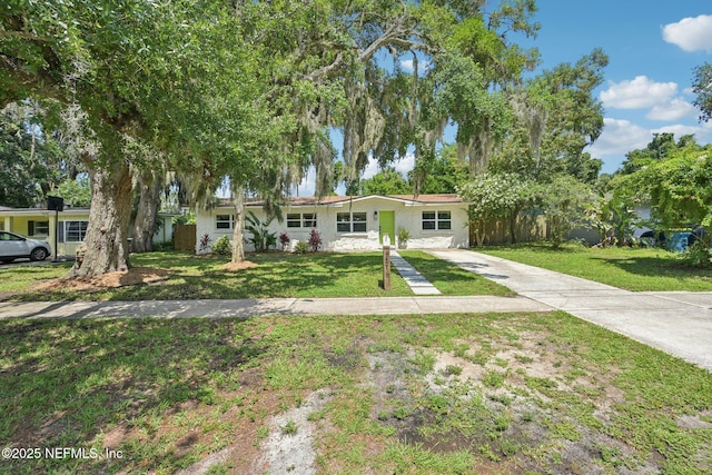 2619 Montreal St, Jacksonville, FL 32233 - ranch-style home with concrete driveway and stucco siding