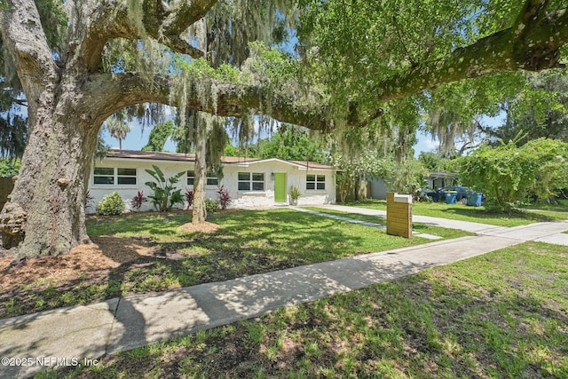 2619 Montreal St, Jacksonville, FL 32233 - ranch-style house featuring stucco siding and a front yard