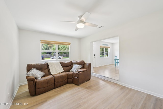 2619 Montreal St, Jacksonville, FL 32233 - living room with light wood-style flooring, healthy amount of natural light, and a ceiling fan