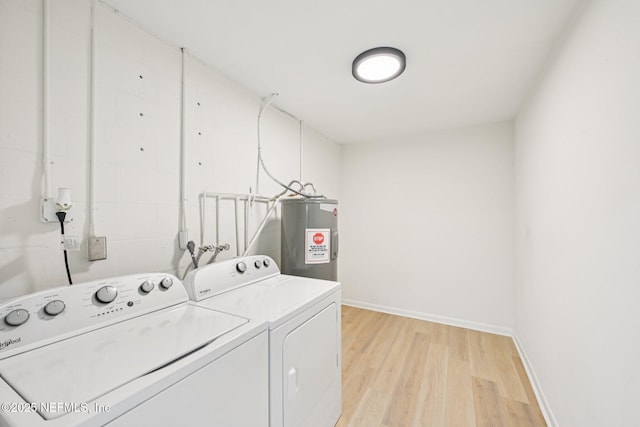 2619 Montreal St, Jacksonville, FL 32233 - washroom with water heater, washing machine and dryer, and light wood-style flooring