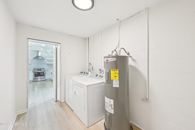 2619 Montreal St, Jacksonville, FL 32233 - laundry room featuring water heater, washing machine and dryer, and light wood-style floors