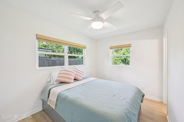 2619 Montreal St, Jacksonville, FL 32233 - bedroom featuring wood finished floors, a textured ceiling, and a ceiling fan
